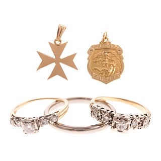 A Collection of Diamond Rings & Charms in Gold