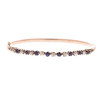 A Ladies Diamond & Sapphire Bracelet in 14K