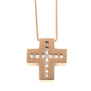 A Ladies Diamond Cross and Chain in 14K