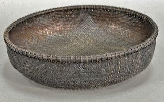 Silver woven round basket. dia. 10 in., 17.7 t oz. 
Provenance: Estate of Kenneth Jay Lane