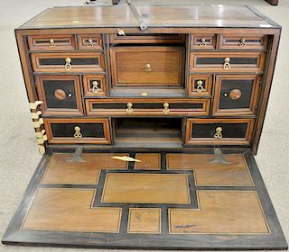 Spanish walnut and ebonized fruitwood drop front desk top 17th/18th century, interior with fitted drawers and doors, gilt metal hand...