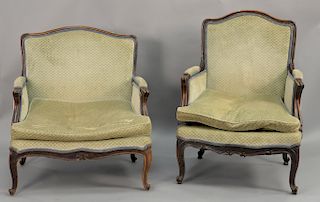 Two near matching Louis XV style armchairs.
