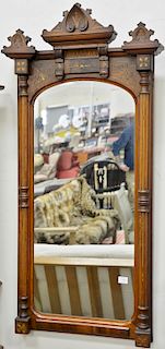 Two piece lot to include a Victorian walnut mirror, ht. 53 in., wd. 23 1/2in. and oval Victorian mirror, 41'' x 19''