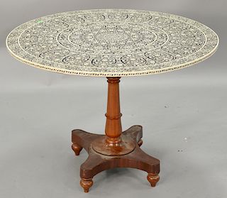 Eastern tip top table having bone and ebony inlaid round top on pedestal base (loose). ht. 29 in., dia. 40 in.   Provenance: Estat...