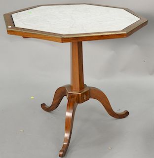 Mahogany stand with octagon inset marble top. ht. 28 in., dia. 29 in. 
Provenance: Estate of Kenneth Jay Lane