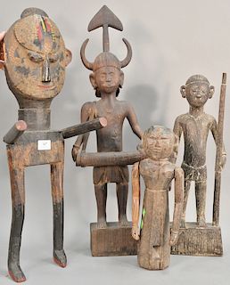 Four hand carved wooden tribal figures/sculptures. ht. 16 in. to 29 in. 
Provenance: Estate of Kenneth Jay Lane