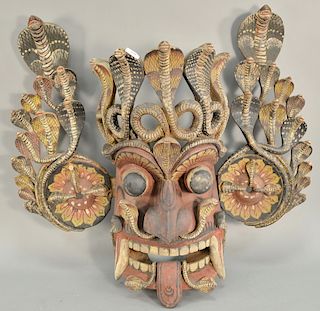 Large painted and carved wood serpent headdress mask of cobra snakes, 18th/19th century. ht. 33 in., wd. 37 in. 
Provenance: Estate ...