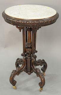 Round walnut marble top table with old crack in marble. ht. 31 in., dia. 21 1/2 in.