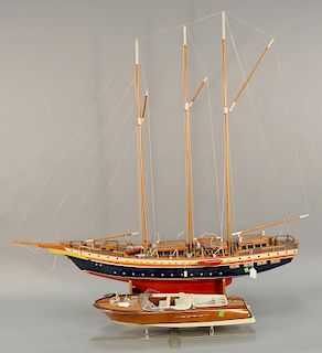 Two piece lot to include "Authentic Model" runabout mahogany cruise boat on stand, lg. 25 in. and a Three masted sailing ship model,...