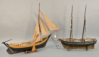 Two ship models including a Dutch fisherman and a two masted ship (as is). ht. 36 1/2 in., lg. 48 in. and ht. 34 1/2 in., lg. 40 1/2...