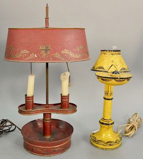 Two tole lamps including a double candlestick bouillotte red painted along with a yellow and black painted single oil lamp, both ele...