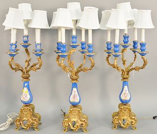 Set of three candelabra lamps, electrified with porcelain inserts. ht. 32 1/2 in.