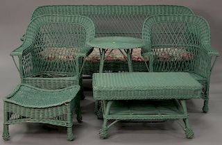 Six piece Bar Harbor wicker set to include sofa (lg. 83 in.), two arm chairs, a foot stool, round table, and coffee table.