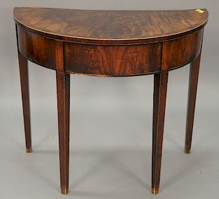 Mahogany demilune table. ht. 28 in., wd. 33 in.