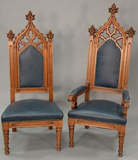 Set of six Victorian walnut gothic chairs including four armchairs and two side chairs with leather upholstery. ht. of tallest 61 i...