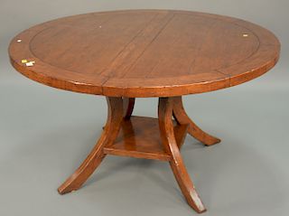 Round pedestal table with one 18 inch leaf. ht. 30 in., dia. 54 in.