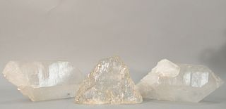 Three large quartz crystal specimen. lg. 9 in., 16 in., and 17 in.  Provenance: Estate of Kenneth Jay Lane