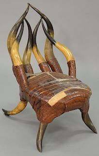 Horned side chair having horned back and legs with furred skin seat. ht. 31 in. 
Provenance: Estate of Kenneth Jay Lane, 
Sotheby Pa...