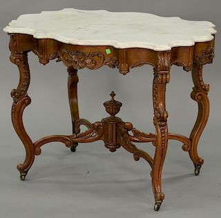 Victorian rosewood table with highly scalloped marble top (sun faded). ht. 30 in., top: 28" x 39"