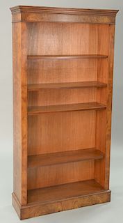 Three burlwood bookcases. tallest: ht. 72 in., wd. 36 1/2 in. 
Provenance: Estate of Kenneth Jay Lane