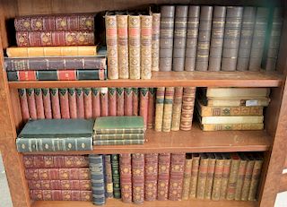 Various leather bound books including 9 volumes of Shakespeare, 19 volumes of George Eliot's Works, etc. in addition to books on two...