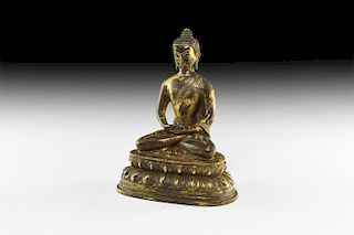 Tibetan Gilt Sitting Buddha Statuette