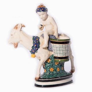 Boy Riding a Goat with on an Oval Pedestal.