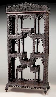 Chinese carved hardwood curio cabinet.
