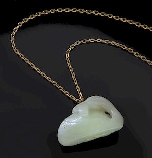 Chinese Qing carved jade pendant with gold