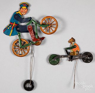 Two tin lithograph bicycle balance toys