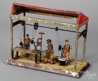 Arnold painted tin three man workshop steam toy