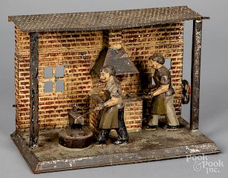 Painted tin blacksmith steam toy accessory
