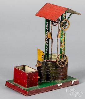 Painted and lithograph tin wishing well steam toy