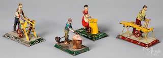 Four painted tin worker steam toy accessories
