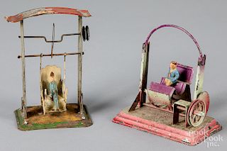 Two painted tin carnival steam toy accessories