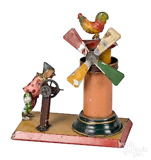 Unusual painted tin clown and windmill steam toy