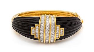 An 18 Karat Yellow Gold, Diamond and Onyx Bangle Bracelet, Montreaux, 69.45 dwts.