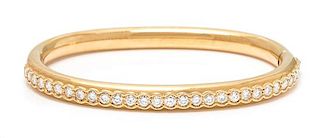 An 18 Karat Yellow Gold and Diamond Bangle Bracelet, Swiss, 23.25 dwts.