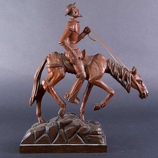 Don Quijote a caballo. Siglo XX. En talla de madera.