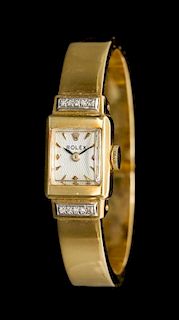 An 18 Karat Yellow Gold Cuff Bracelet Wristwatch, Rolex for Bucherer,