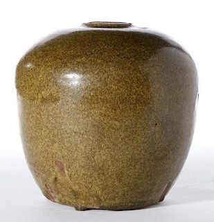 A 15th century Chinese Ming period tea-dust glazed jar.