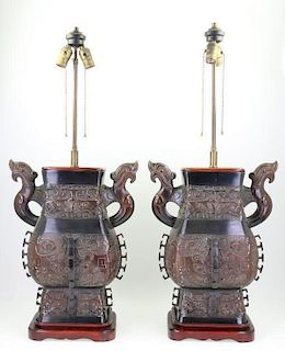 A pair of Archaic style lamps.