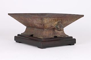 Archaic style metal vessel on stand.