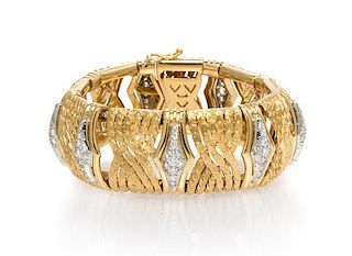* An 18 Karat Yellow Gold and Diamond Bracelet, 54.85 dwts.