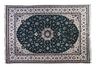 * An Isfahan Wool Rug, 14 feet 2 inches x 10 feet 1 inch.