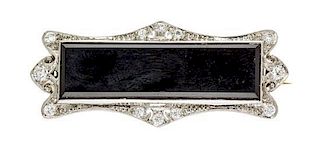 An Art Deco Platinum, Diamond and Onyx Brooch, Tiffany & Co., 5.0 dwts.