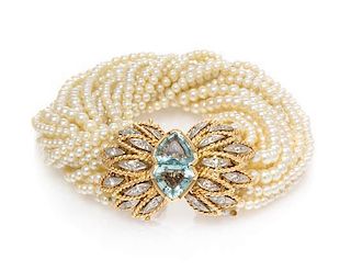A 14 Karat Yellow Gold, Aquamarine, Diamond and Cultured Pearl Multi Strand Bracelet, 34.80 dwts.