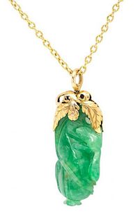A Yellow Gold and Carved Jade Pendant, 6.10 dwts.