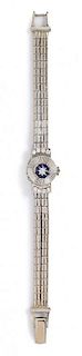 A 14 White Gold, Diamond and Sapphire Surprise Wristwatch, Jean Sybe, 19.30 dwts.