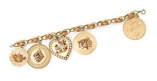 A 14 Karat Yellow Gold Charm Bracelet with Five Attached Charms, 33.40 dwts.